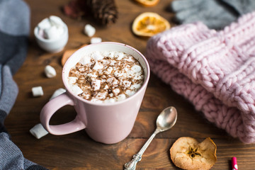 winter still life: hat, gloves, hot chocolate with marshmallows