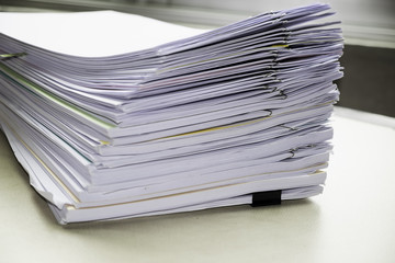 Pile of unfinished documents on office desk, Stack of business paper