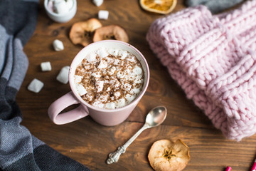winter still life: hat, gloves, hot chocolate with marshmallows
