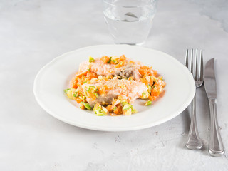 Steamed salmon with sesame seeds on white plate