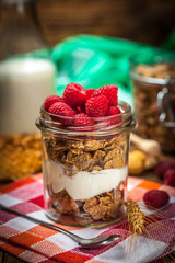 Bowl of cereals with blueberries and raspberrie.
