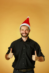 Smiling christmas man wearing a santa hat