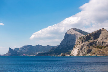 Fototapeta premium Sea and mountains against the sky