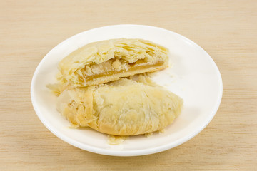 The Taiwanese sun cake (milk butter pastry) on the small white dish.