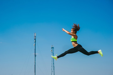 sports girl against the sky