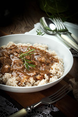 Cooked barley porridge and stew of pork.