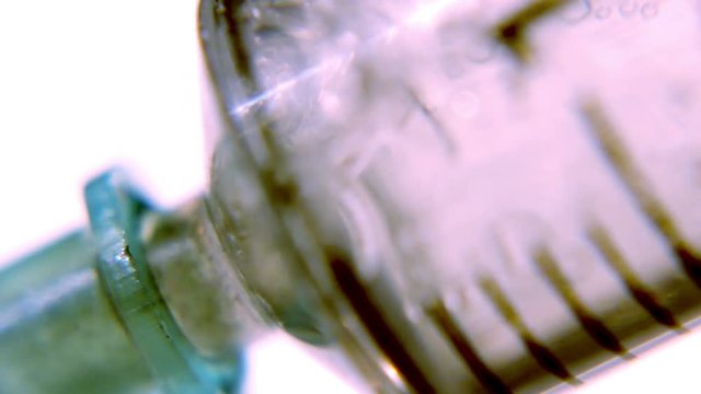 Sucking up transparent liquid into a medical syringe