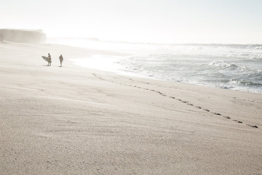 Surfers getting ready on the beach