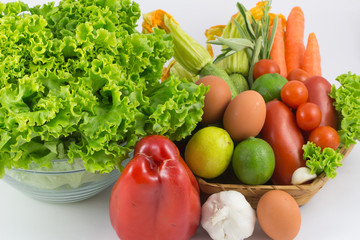 Fresh vegetables mix isolated on white / colorful fresh vegetable with leaves isolated on white background / fresh vegetables with leaves in the basket isolated on white background.