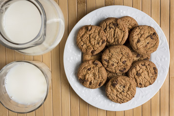 Cookies and Milk / Top View of Cookies and Milk on a Wooden Background
