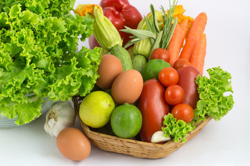 Fresh vegetables mix isolated on white / colorful fresh vegetable with leaves isolated on white background / fresh vegetables with leaves in the basket isolated on white background.