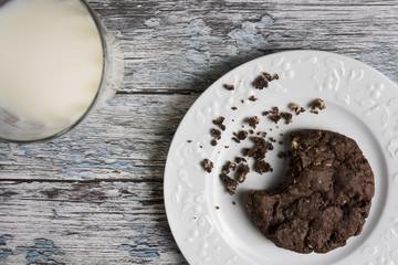 Cookies and Milk / Top View of Cookies and Milk on a Wooden Background
