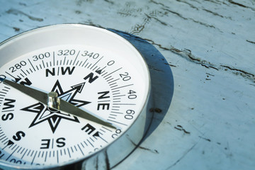 compass on old wood painted table