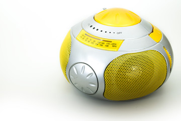 a yellow modern radio in a white background, isolated