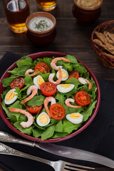 Bowl of fresh salad with shrimps and eggs
