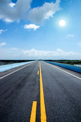 Fototapeta premium Empty road with blue sky.