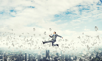 Businessman jumping high