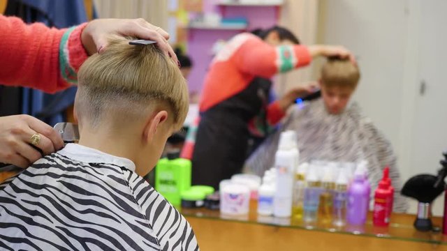 child's haircut at the Barber shop.looking at yourself in the mirror