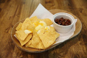 Cheese nachos with tomato sauce