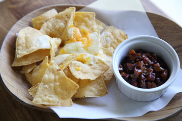 Cheese nachos with tomato sauce