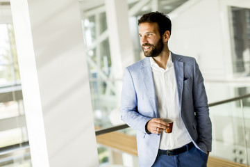 Fototapeta premium Businessman drinking coffee