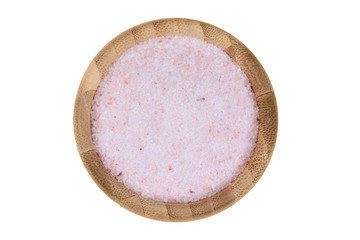 Pink salt in a bamboo bowl on white background