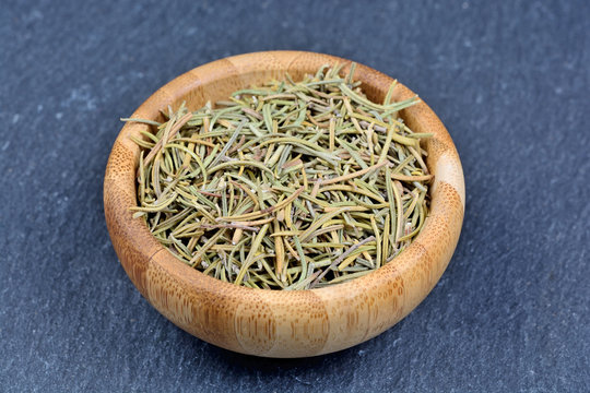 Dry rosemary in a bamboo bowl