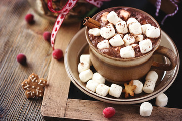 Fototapeta na wymiar Hot cacao drink with marshmallows, gift box and christmas cookie