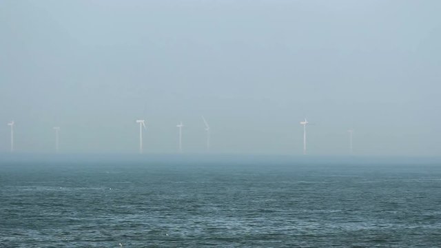Offshore windturbines on the shoreline of North Wales