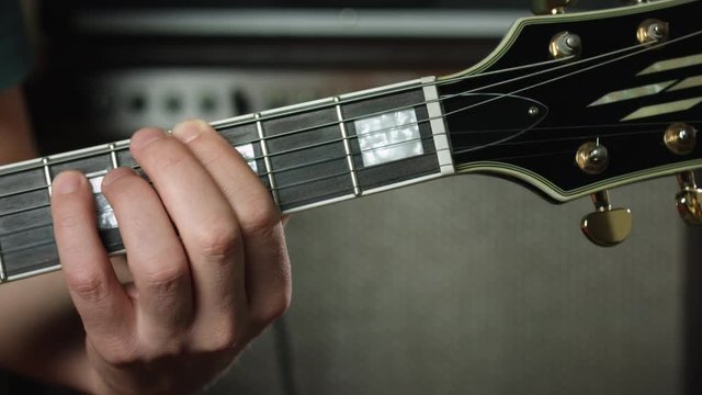 Guitarist play two note chords on electric guitar