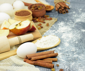 Fototapeta na wymiar Cinnamon and organic foods closeup. Homemade baking. Close-up.
