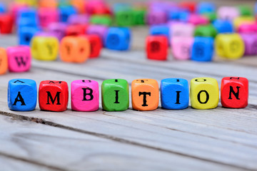 Ambition word on wooden table