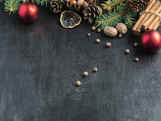 Christmas background with spices, fir branches and cones

