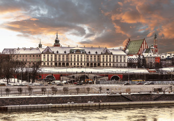 Fototapeta na wymiar View of the Royal Castle and the Vistula river in the Old Town of Warsaw at winter sunset, Poland