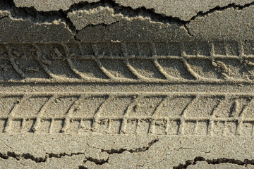 Motorcycle motocross tracks in the sand. © noppharat