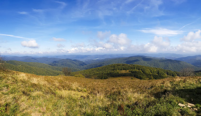 Fototapeta premium Mountains scenery. Panorama of grassland and forest in Bieszczady National Park. Carpathians landscape, Poland.