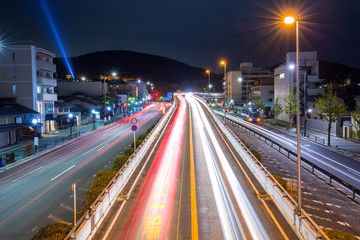 Traffic lights on the street of Kyoto city at night, Japan