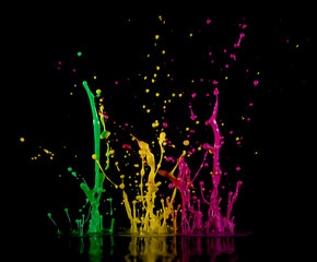 Аbstract sculptures of colorful splashes of paint. Dancing liquid on a black background. Ink water...