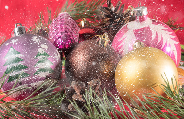 Colorful Christmas balls. Blurred background. falling snowflakes