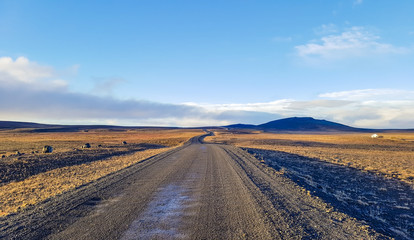 Fototapeta na wymiar Traveling down the gravel road in desert, Kjolur Highland route F35 Volcanic Iceland