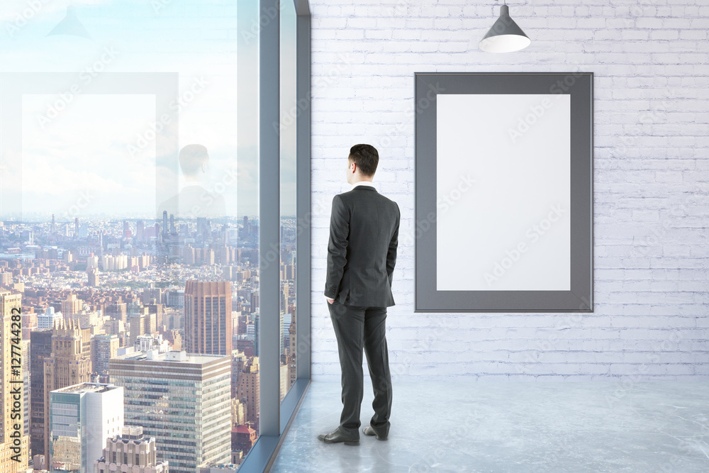 Poster man in room with picture frame