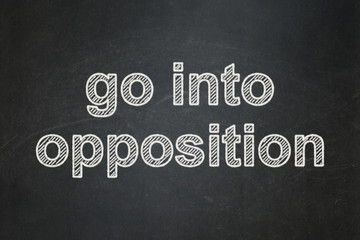 Fototapeta premium Politics concept: Go into Opposition on chalkboard background