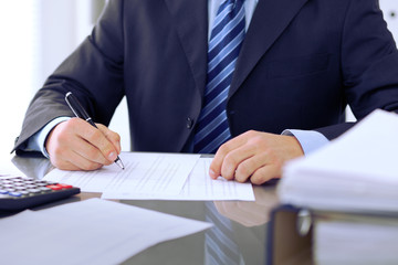 Bookkeepers or financial inspector making report, calculating or checking balance. Audit concept.