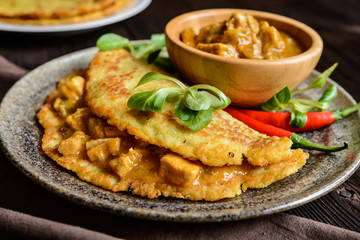 Pork meat with chili sauce in a potato pancake