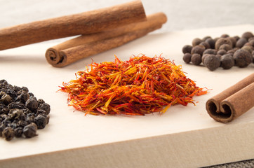 Relishes and spices on a wooden tray