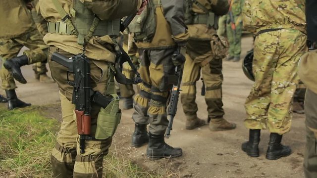 militias are fighting. Men in camouflage with guns and playing airsoft. war