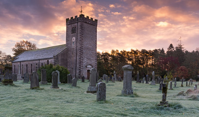 Saint Oswald's Church in the village of Ravenstonedale, Cumbria, England near the Yorkshire Dales on a frosty sunrise morning. Finished in 1744 the site contains ruins of a 13/14th Century cloister.