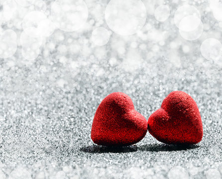 The red Heart on abstract light glitter background