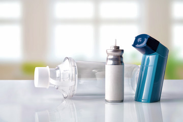 Cartridge inhaler and inhalation chamber in a room front view