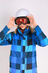 Woman sexy hot skier or snowboarder girl ski googles holding hel